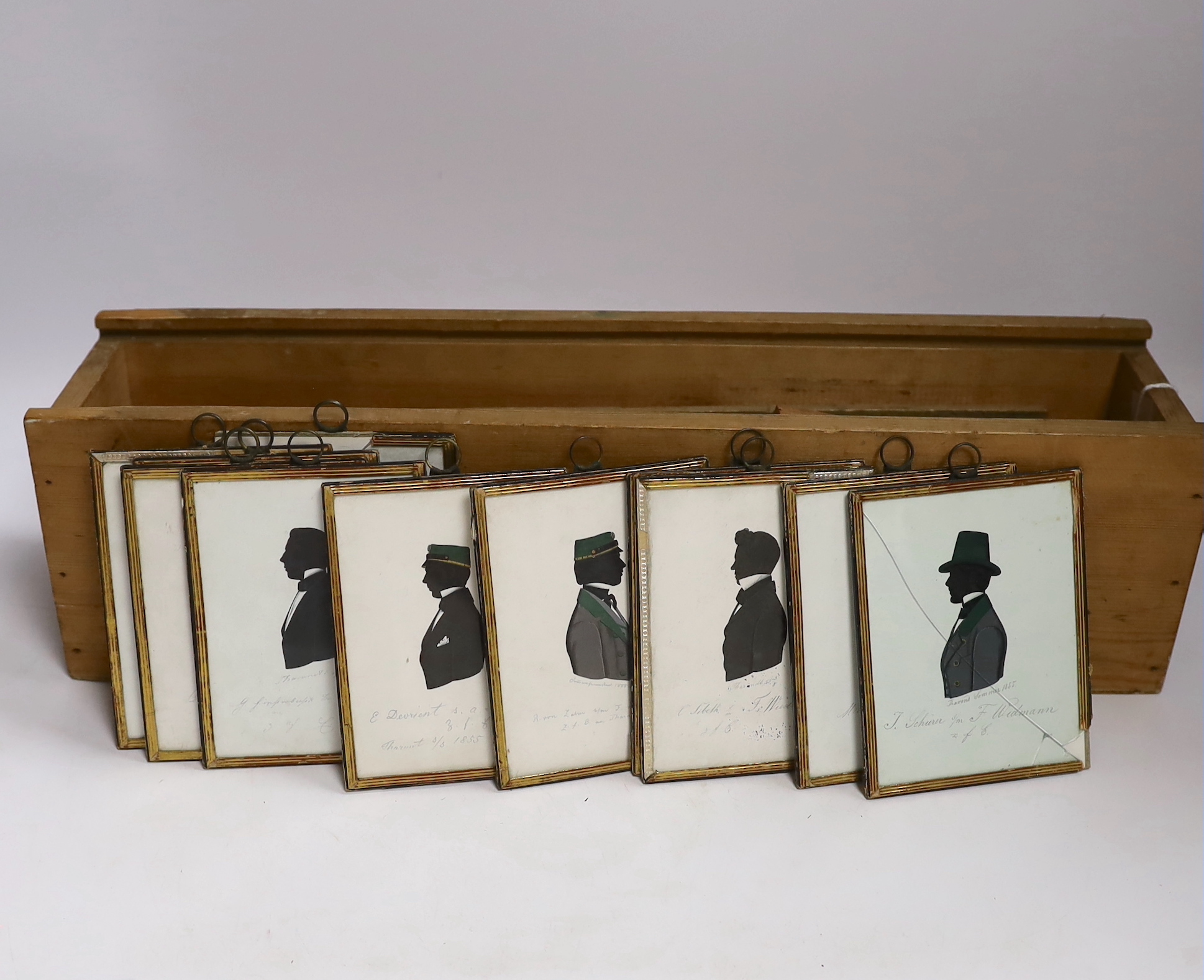 Eleven mid Victorian silhouette portraits together with magic lantern slides